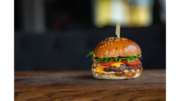 Close-up of burger on wooden table,Tondon Mamullu Makale Tana Toraja Regency,South Sulawesi,Indonesia
