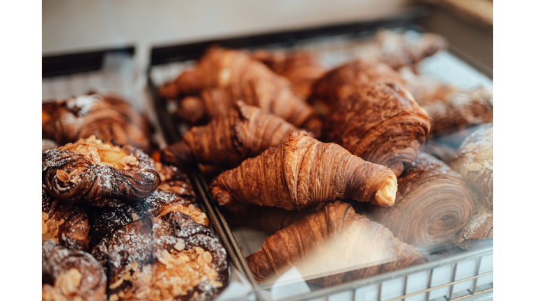 Close-up of fresh French baked pastry in the display cabinet in a cafe.