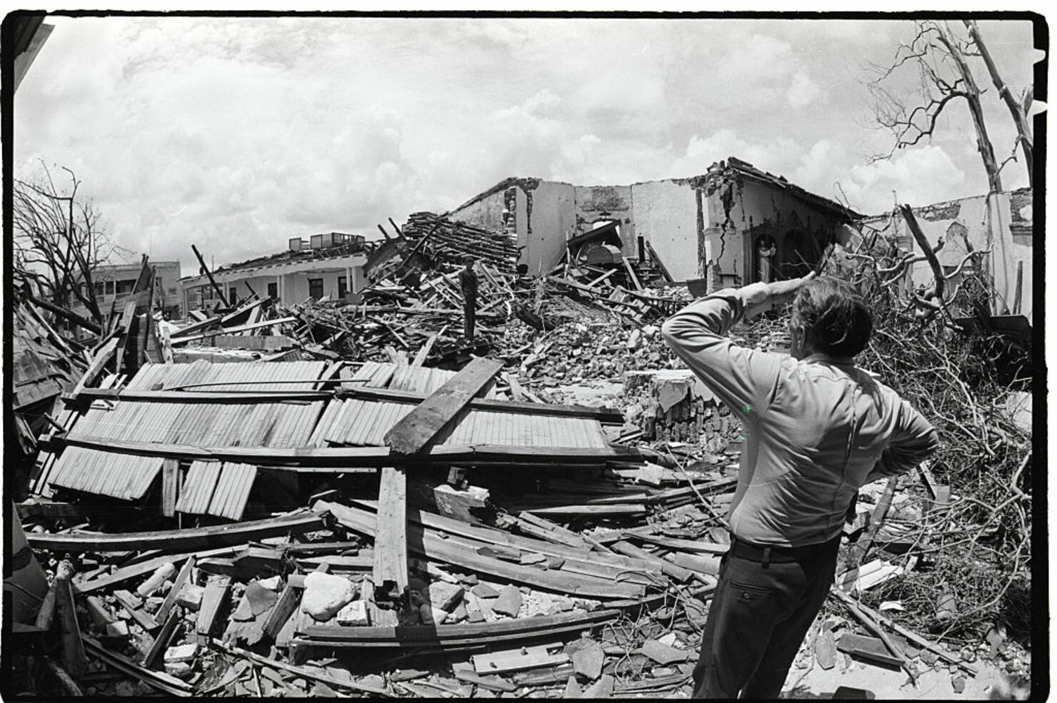 Man Viewing Church Destroyed By Hurrican