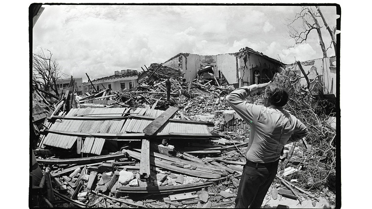 Man Viewing Church Destroyed By Hurrican