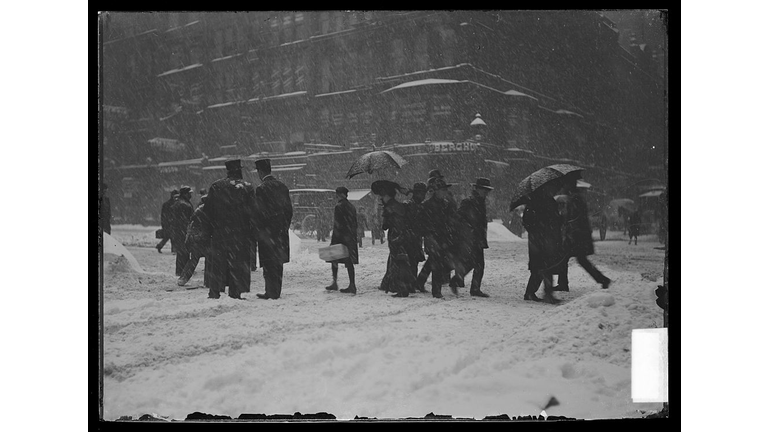 People Walking In Snow Storm