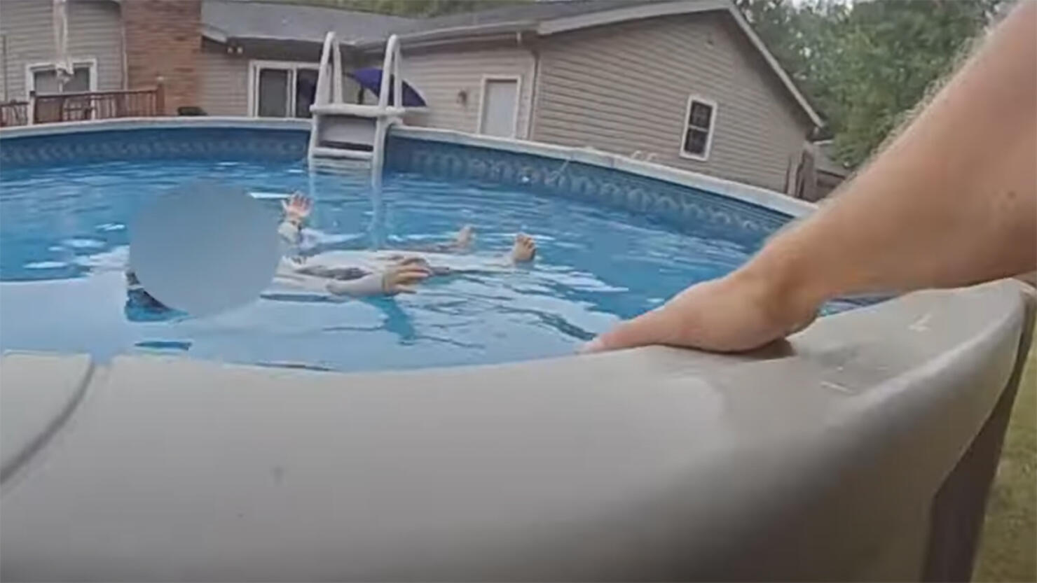 A police finds a missing toddler floating in a pool