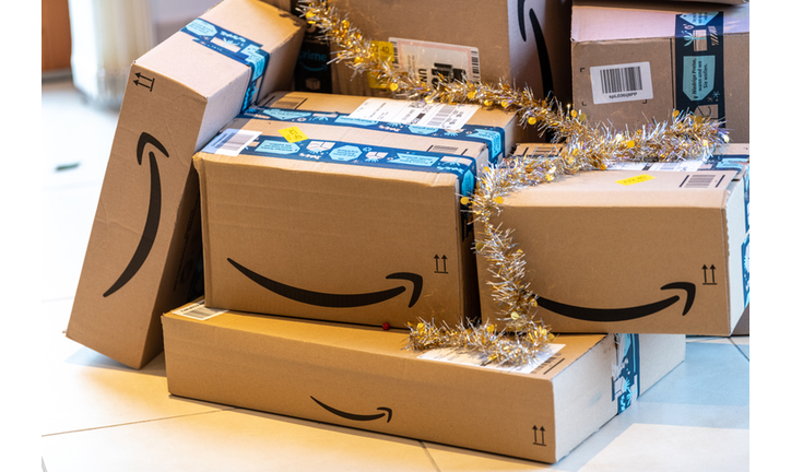 Amazon packages deposited at the foot of the Christmas tree