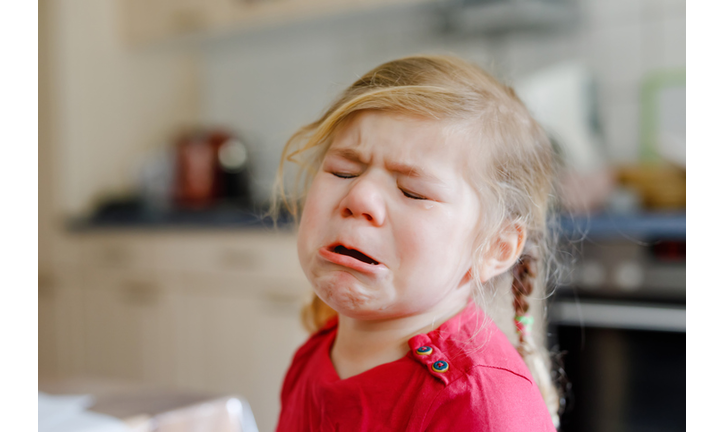 Cute upset unhappy toddler girl crying. Angry emotional child shouting. Portrait of kid with tears.