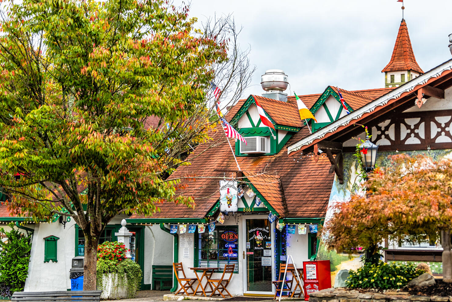 Helen, Georgia Bavarian town with sign on building for Village Crepe Haus restaurant at Oktoberfest festival with traditional architecture