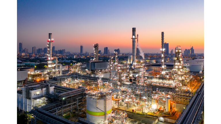 Shot from drone of Oil refinery plant ,Petrochemical plant at dusk.