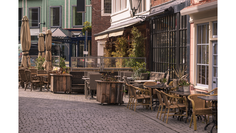 Morning street without people with tables at a cafe in Vlissingen, Holland