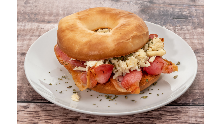 Fresh bagel with grilled bacon and scrambled egg