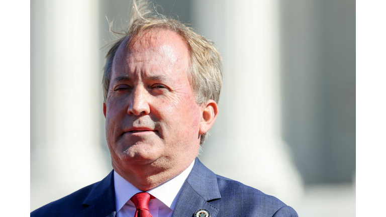 Texas Attorney General Ken Paxton speaks to anti-abortion activists outside the U.S. Supreme Court, in Washington