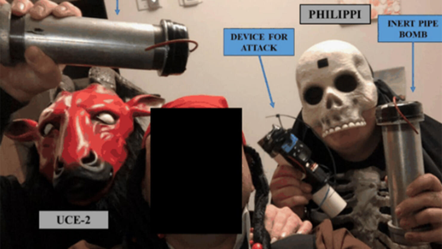 Skyler Philippi posing with pipe bombs