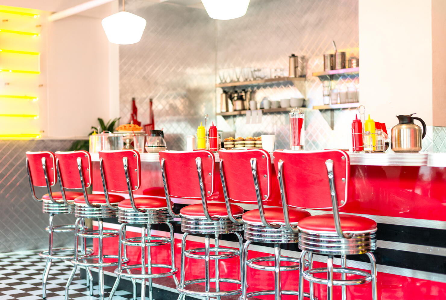 Red stools at the cafe counter