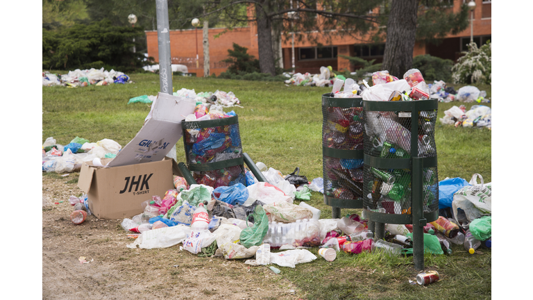 Overflowing bins in a park of Ciudad Universitaria, Madrid