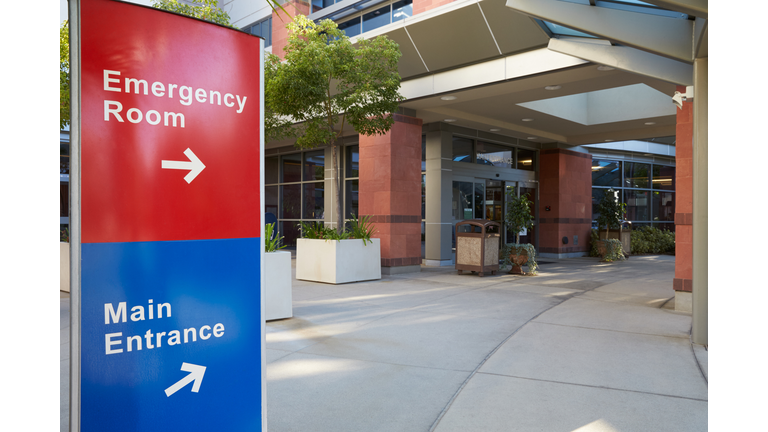 Main Entrance Of Modern Hospital Building With Signs