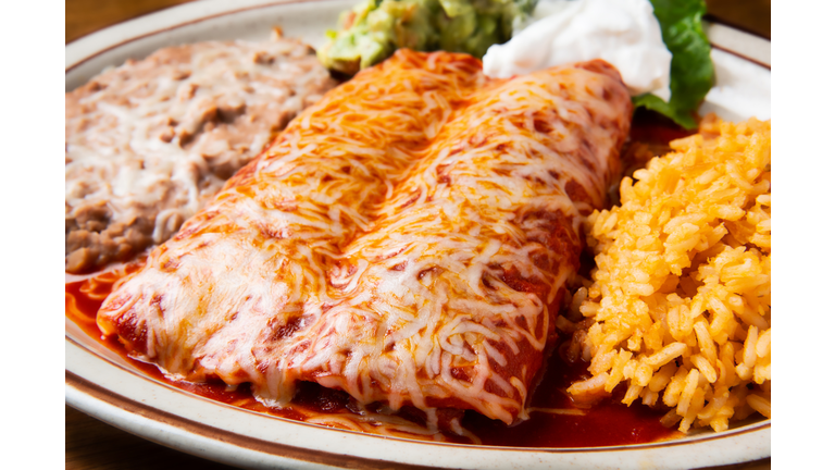 Enchiladas Rojas (Two chicken enchiladas topped with red sauce)