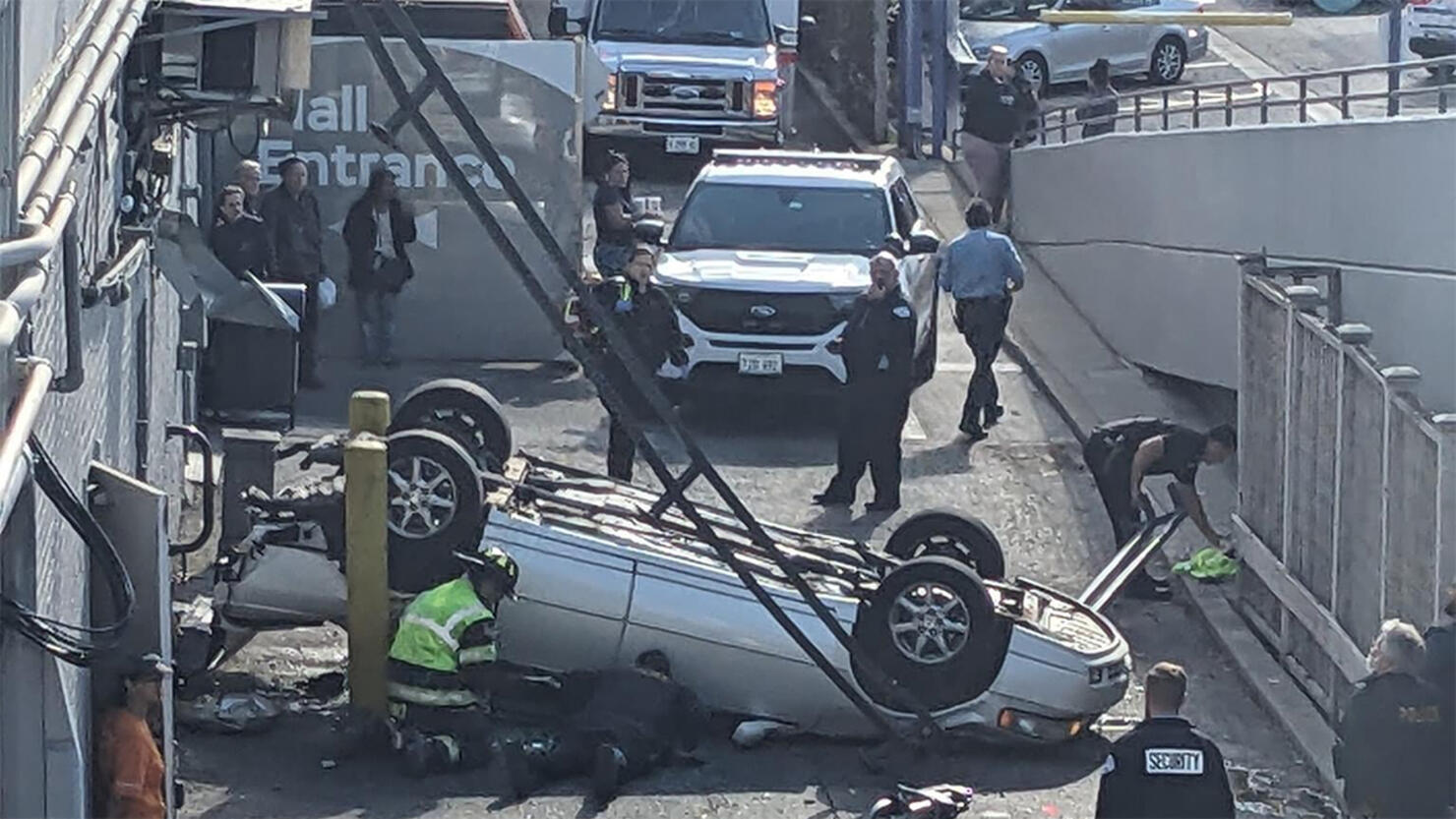 Driver plummets off parking garage