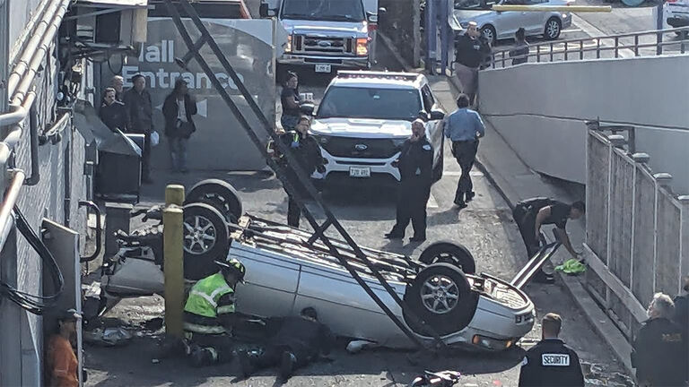 Driver plummets off parking garage