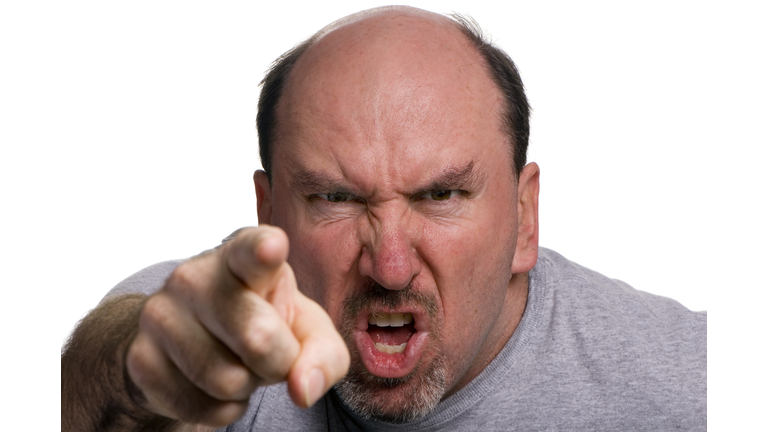 A man looking angry and pointing
