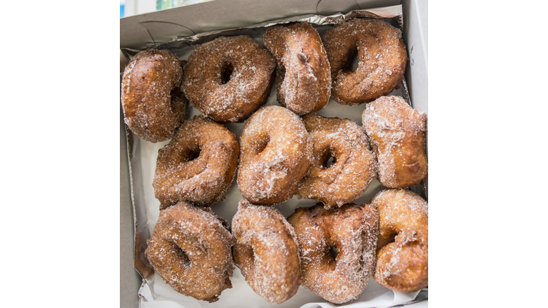 Close up of a boxful of malasadas (portuguese donuts), Hawaii, USA