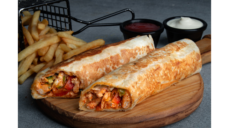 Chicken Fajita Sandwich,Close-up of wrap sandwich on cutting board,United Arab Emirates