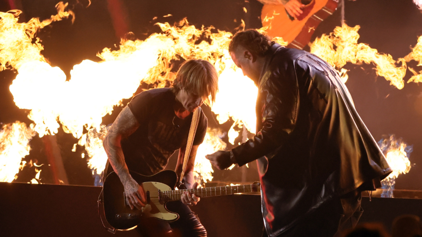 Jelly Roll Sets Stage Ablaze In Electrifying Moment With Keith Urban | iHeart