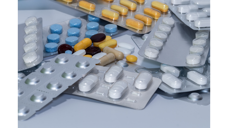 Multicolored pills scattered on white
Assorted pills in vibrant colors