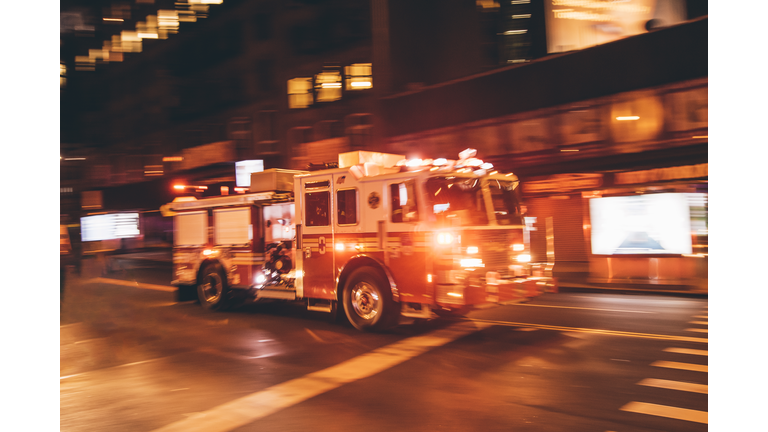 USA, New York City, fire truck coming along the street