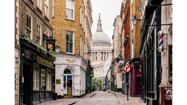 St. Paul's cathedral and street with old historic building in City of London, UK