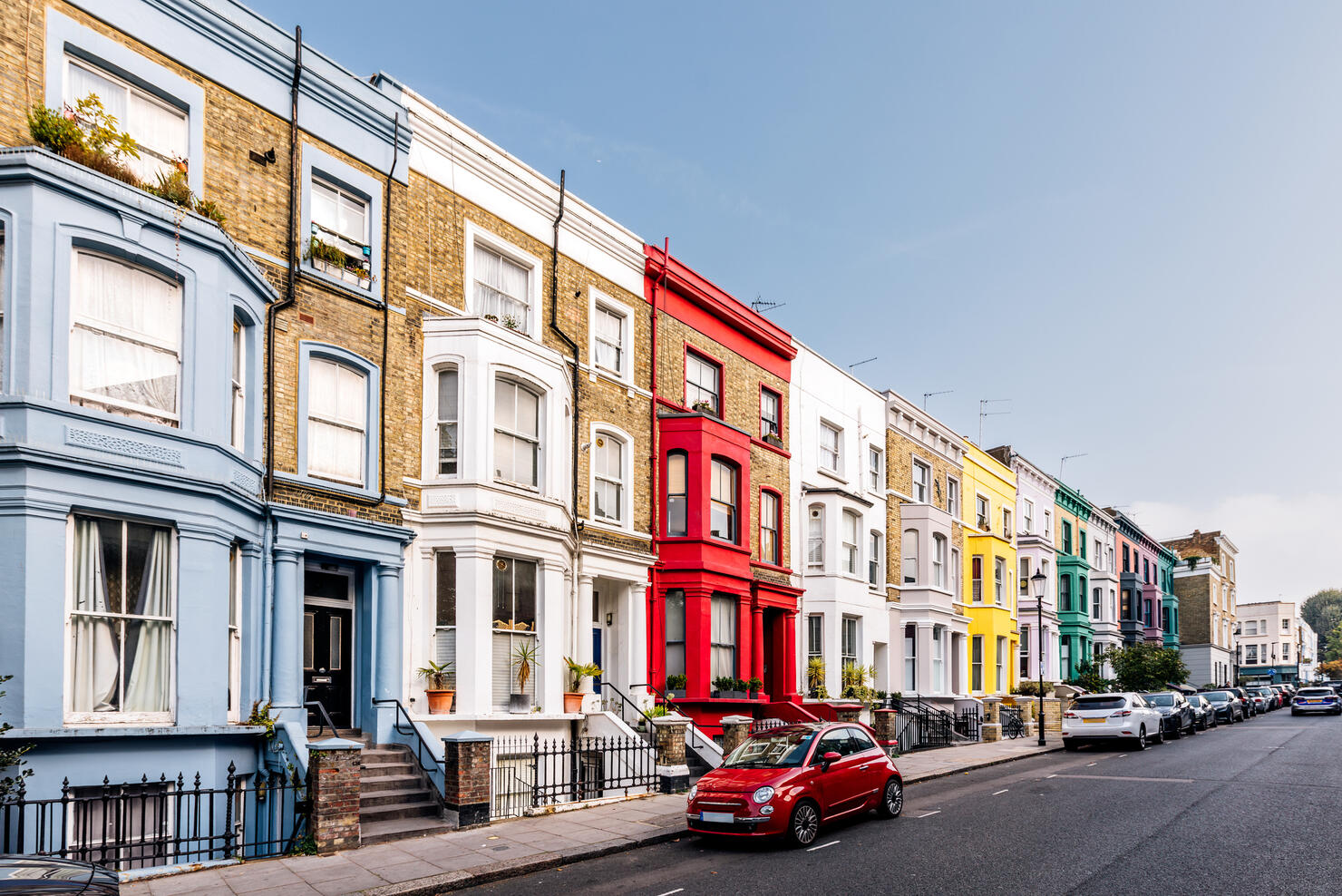 Colourful vibrant terraced houses in Notting Hill on a sunny day, London, UK