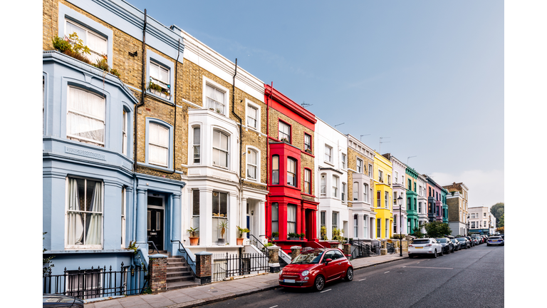 Colourful vibrant terraced houses in Notting Hill on a sunny day, London, UK