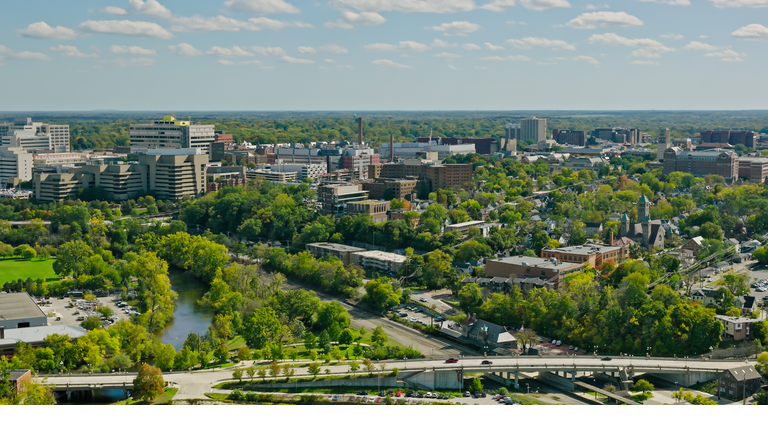 Downtown Ann Arbor overlooking Cityscape on Mostly Clear Day - Aerial