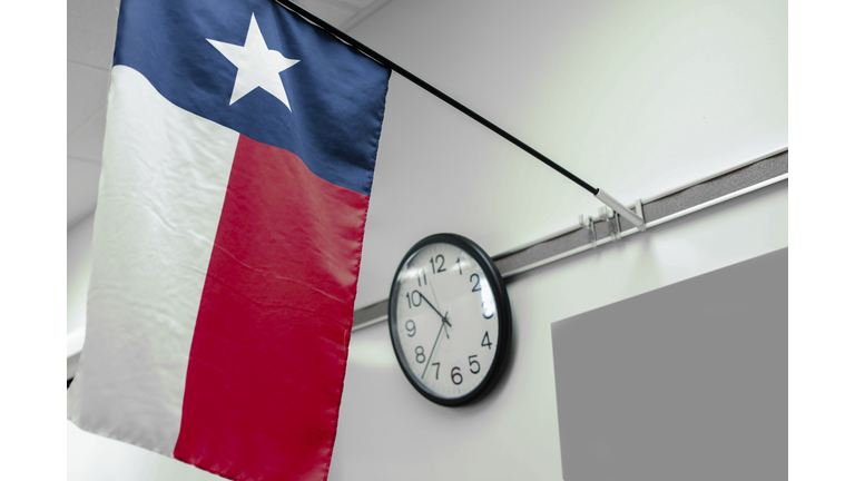 Texas high school classroom flag, clock.