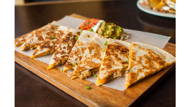 Cheese quesadilla gourmet on a wooden table