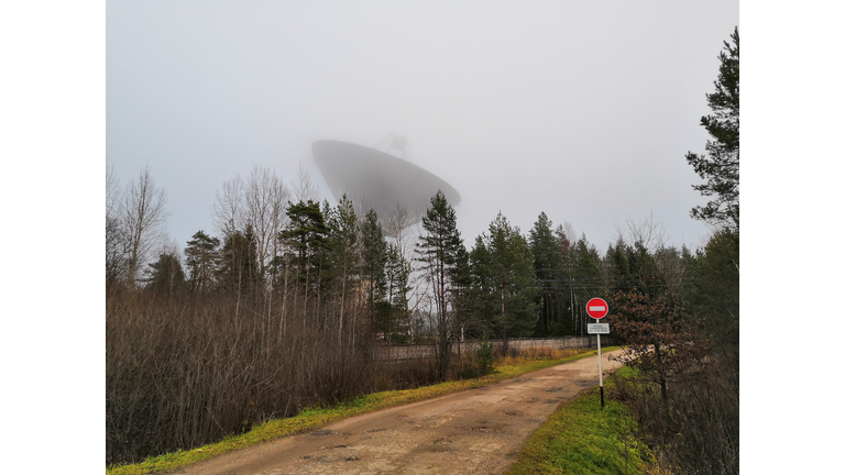 Mystical huge radio telescope in the fog