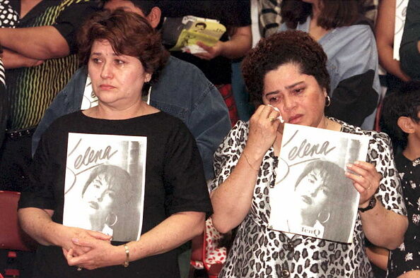 Estella Leak(R) wipes away tears during a memorial