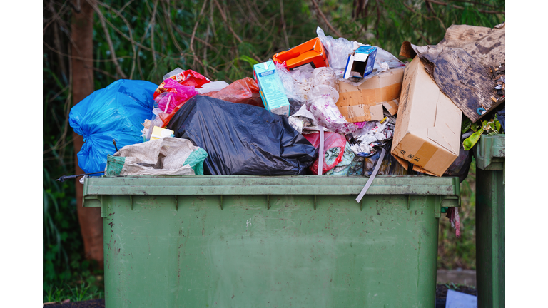 Overflowing Outdoor Garbage Bin