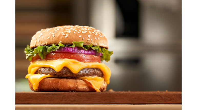 double cheese beef burger with kitchen background