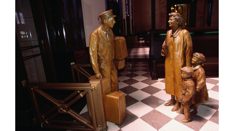 Sculptures of porter and train passengers by John Lajba, Union Station, Durham Heritage Museum.