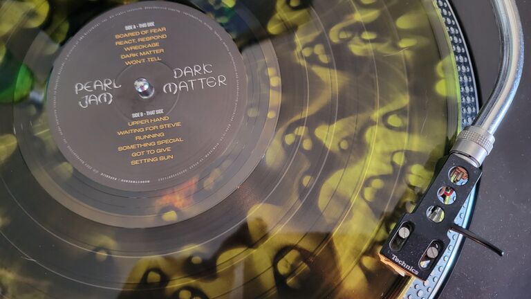 Up close photo of Pearl Jam's Dark Matter vinyl lp on a Technics 1200 turntable