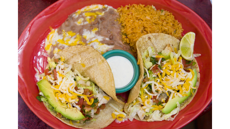Tacos dinner with rice and re fried beans