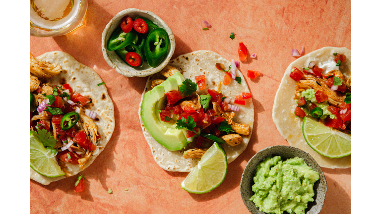 Delicious stuffed tortillas with avocado guacamole on the table
