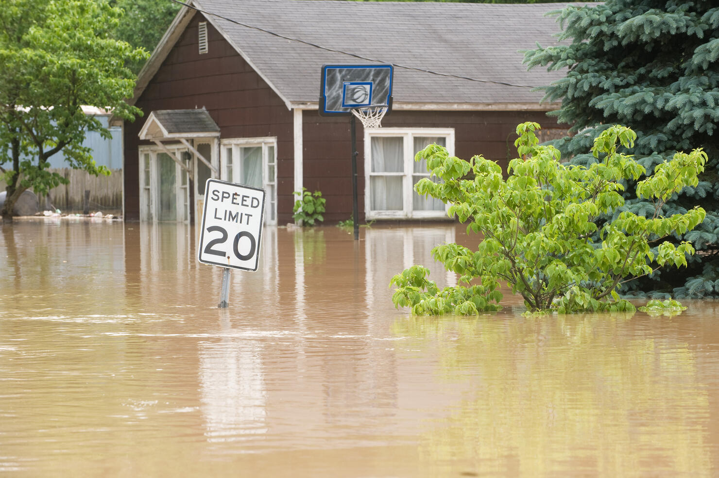 Flood waters in an Indiana town with flooded homes
