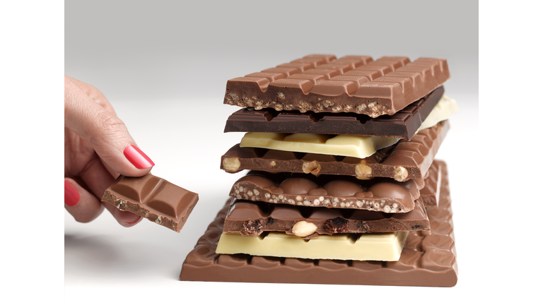 Hand with a stack of chocolate bars