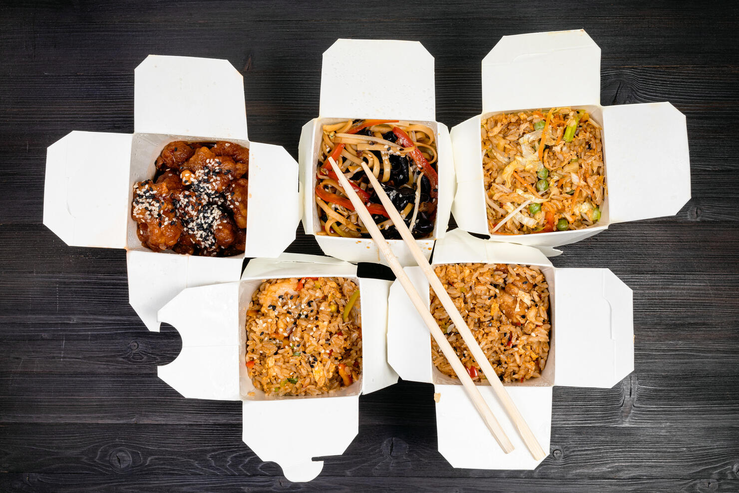 top view of chinese fast food in disposable boxes