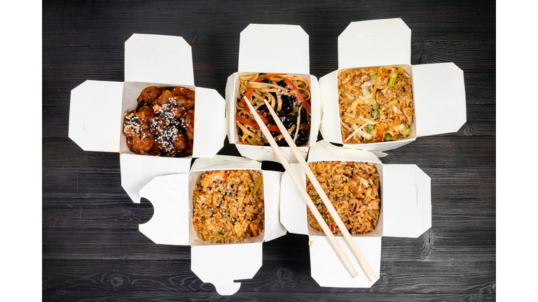 top view of chinese fast food in disposable boxes