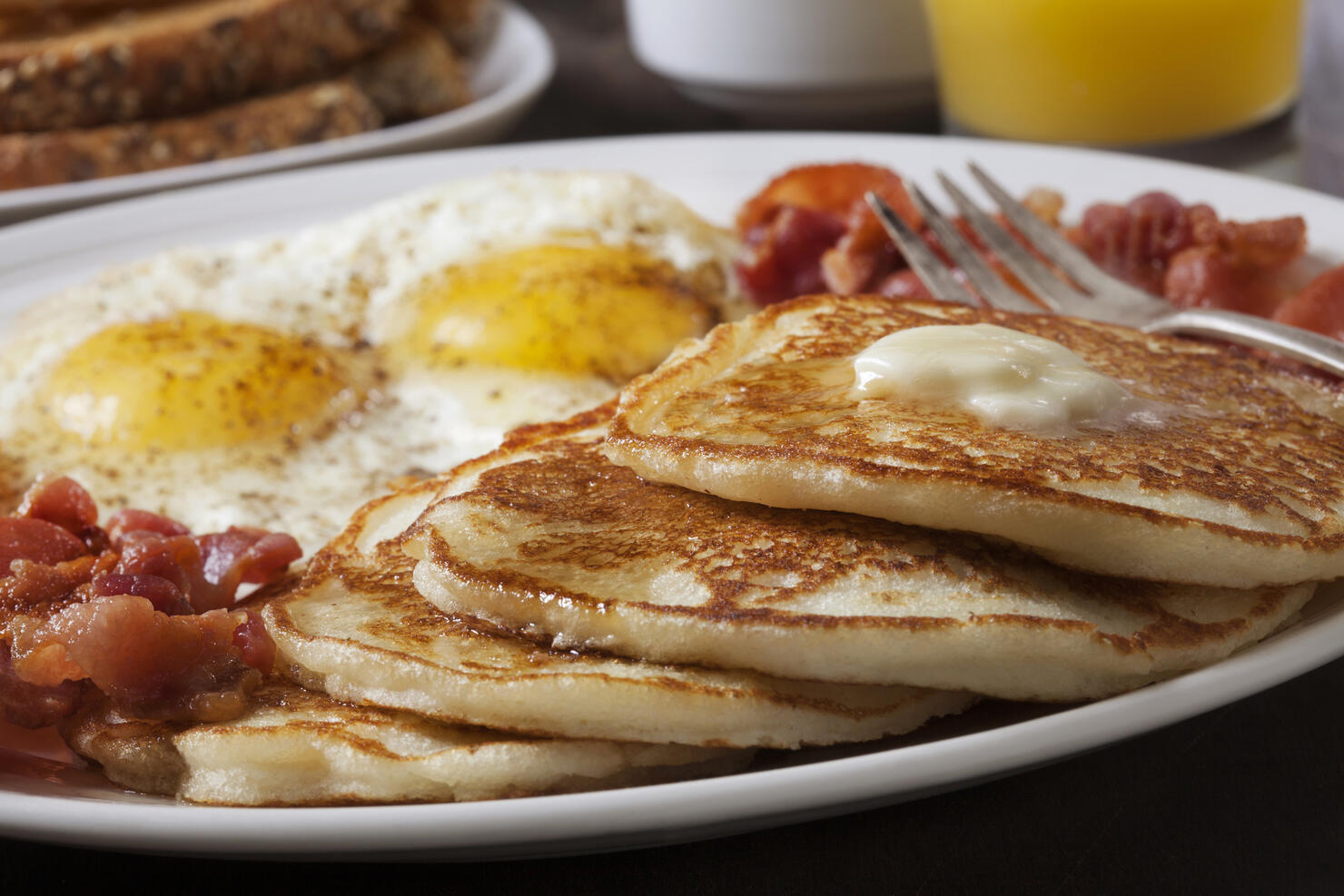 Grand Slam Breakfast with Pancakes, Bacon, Eggs, and Toast