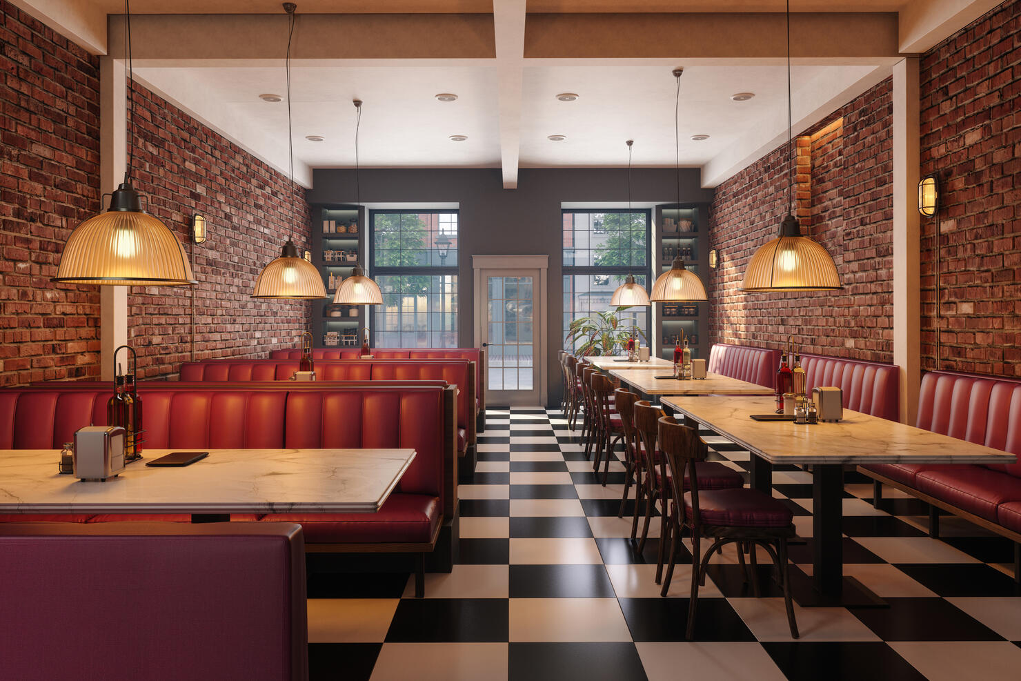 Cafe Interior With Red Seats, Marble Tables, Pendant Lights And Brick Walls