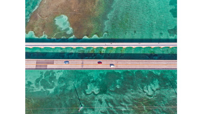Directly above view of the Overseas Highway in Florida Keys with turquoise watercolor.