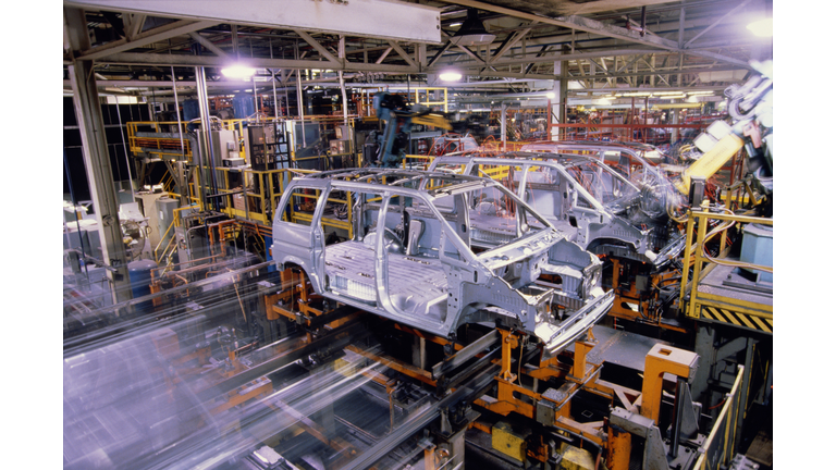 Assembly line,robots welding metal van bodies