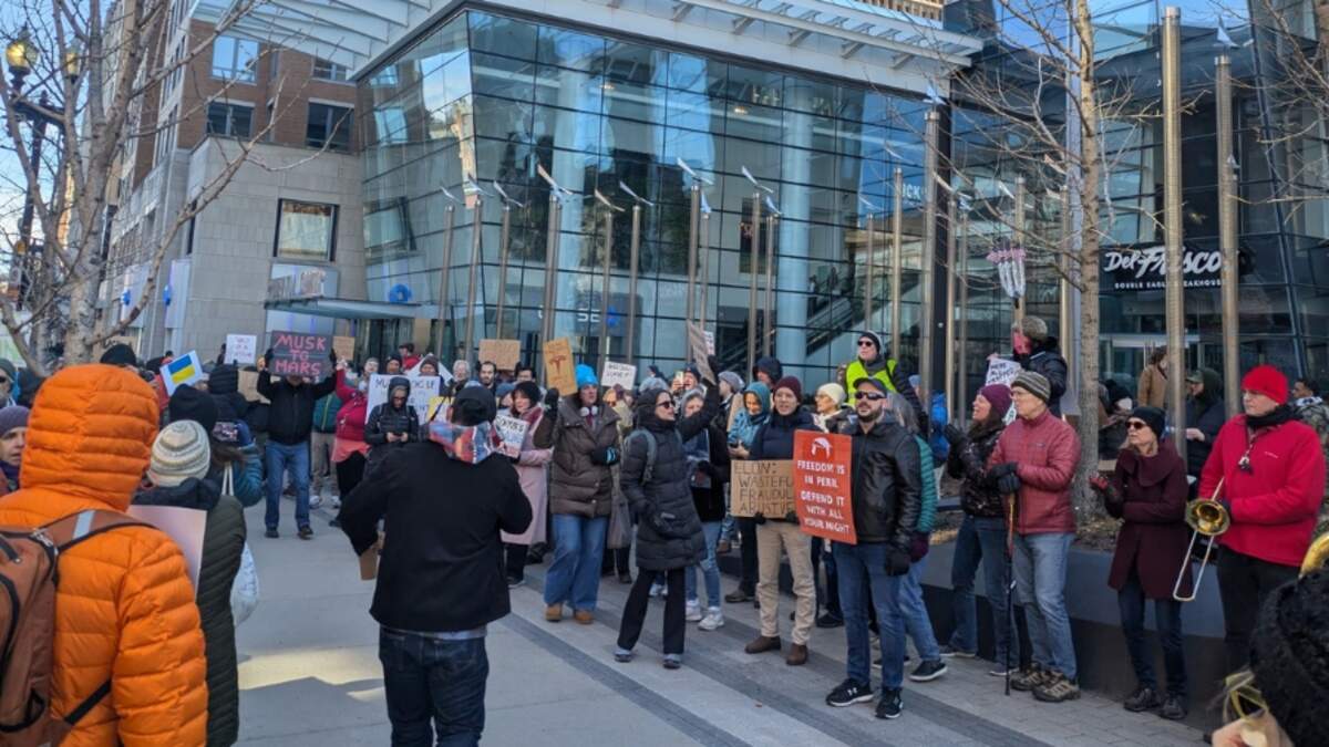 'Tesla Takedowns': Protesters Gather Outside Boston's Tesla Dealership ...