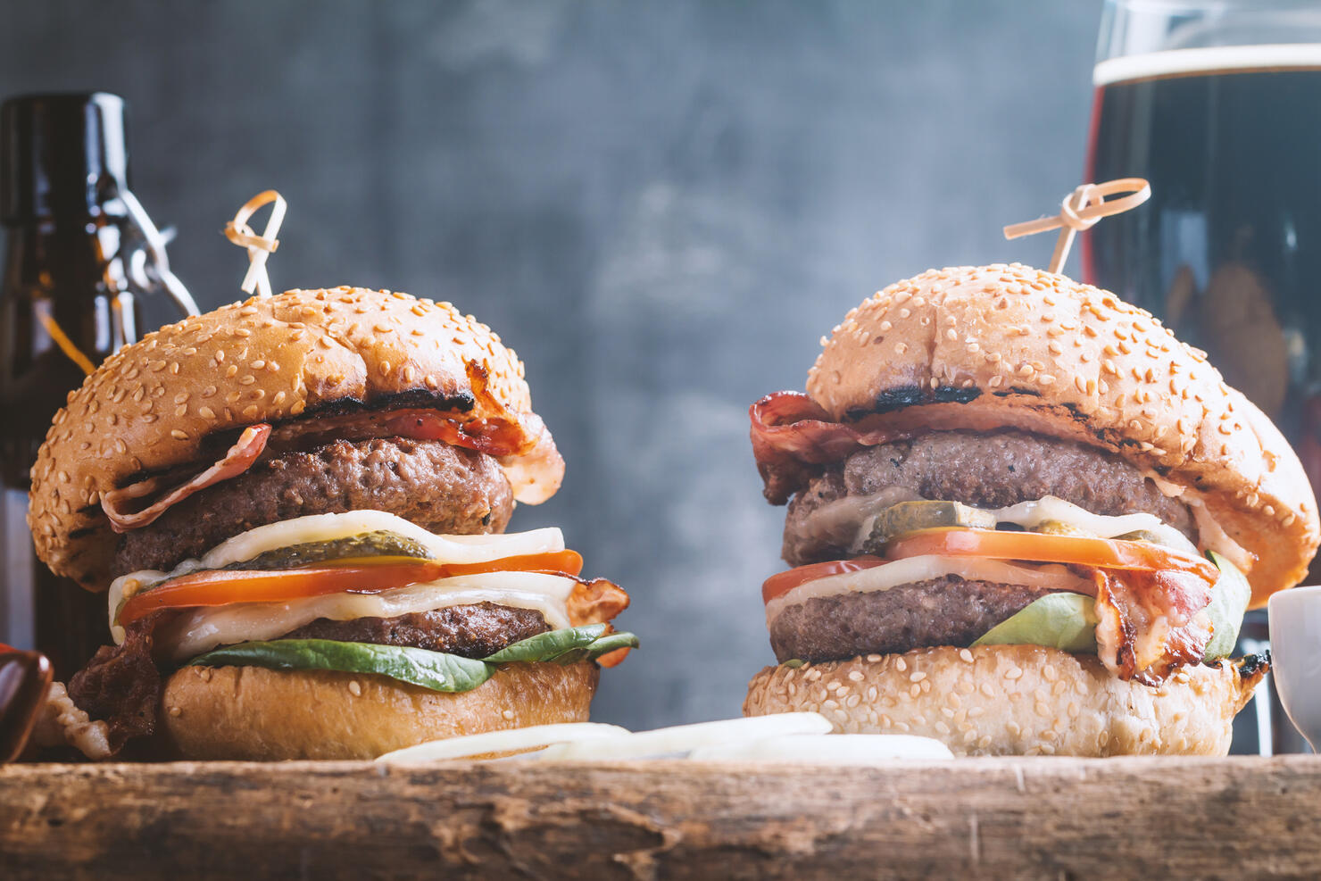 Hamburger and dark beer in vintage style